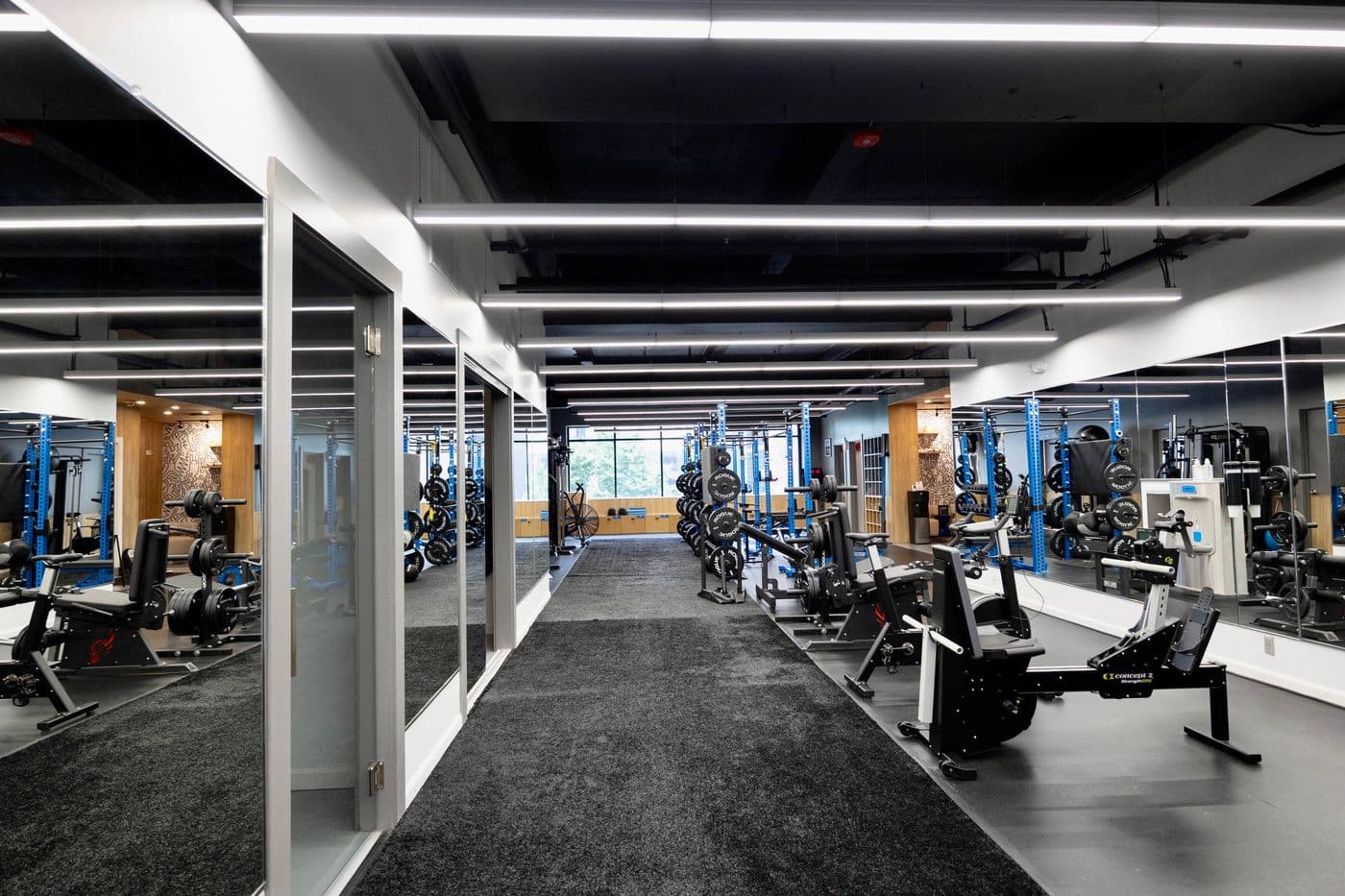 Interior of Studio 617’s new 4,000-square-foot personal training studio featuring squat racks, turf, and recovery tools