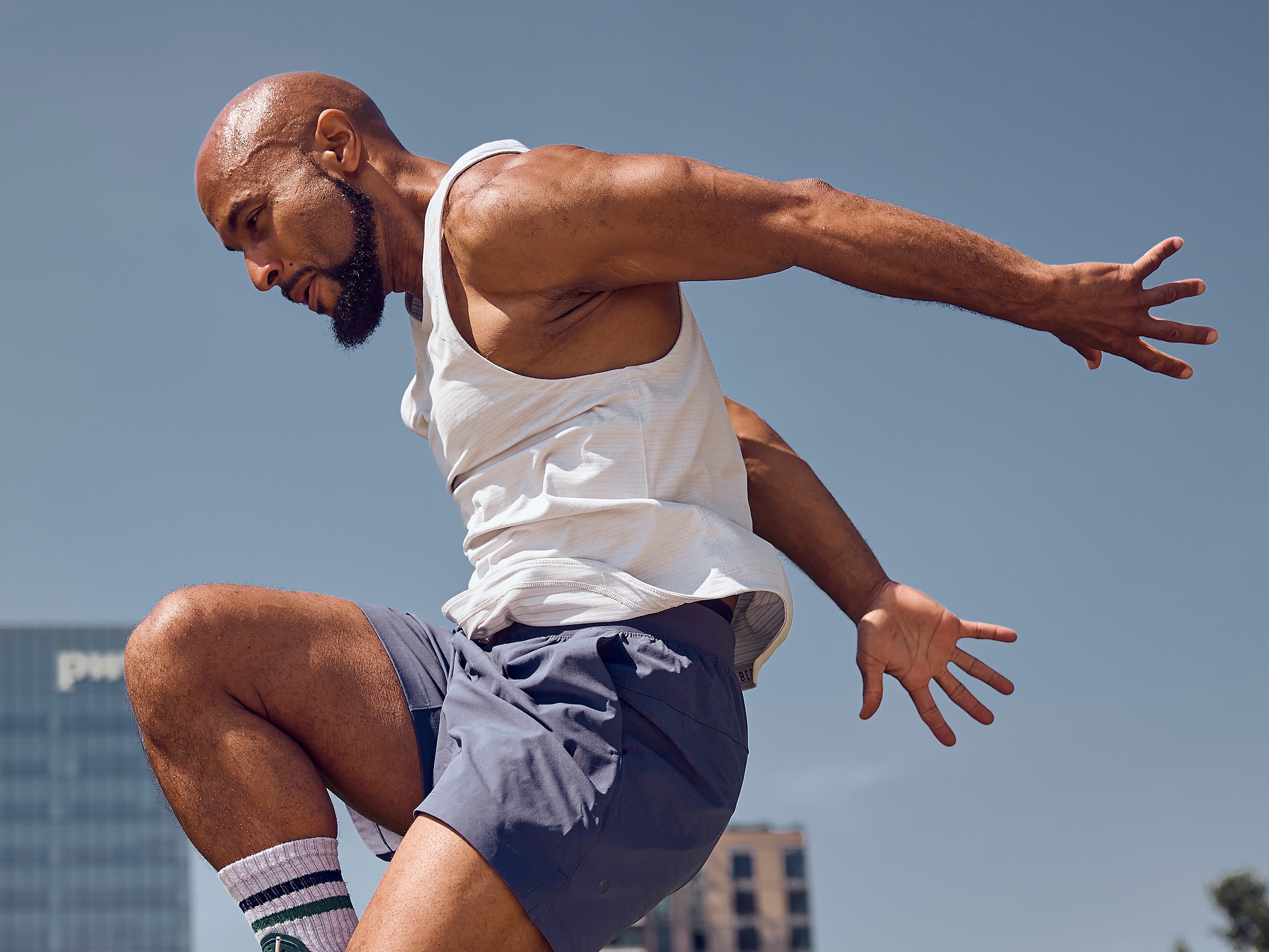 Adrian Bispham, Boston Fitness Instructor leading the Rooftop Wellness Series presented by Fit Scene and View Boston