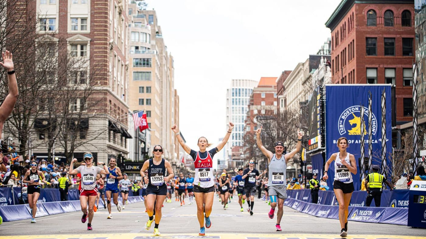 Runners competing in the Boston Marathon on Boylston Street in Boston, MA