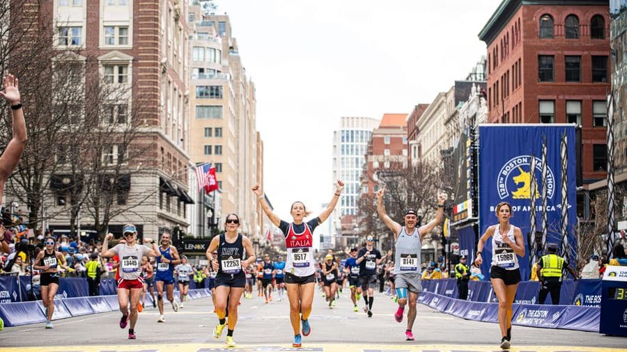 Runners competing in the Boston Marathon on Boylston Street in Boston, MA