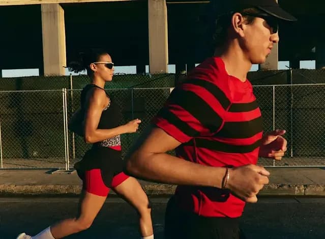 Lululemon Boston '26 advertisement featuring marathon runners celebrating race day.