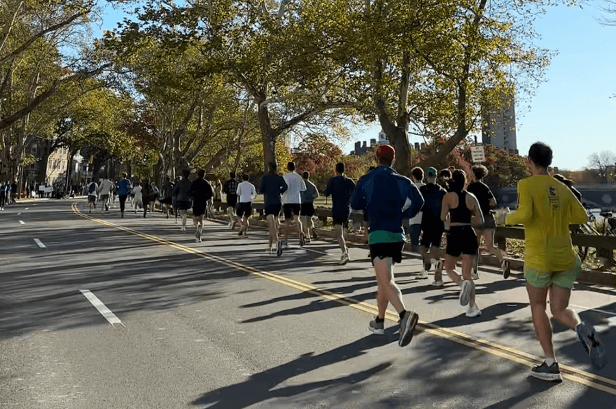 Runners racing in Boston during a fall road race — featured in Fit Scene Boston's Summer & Fall 2026 Race Guide.